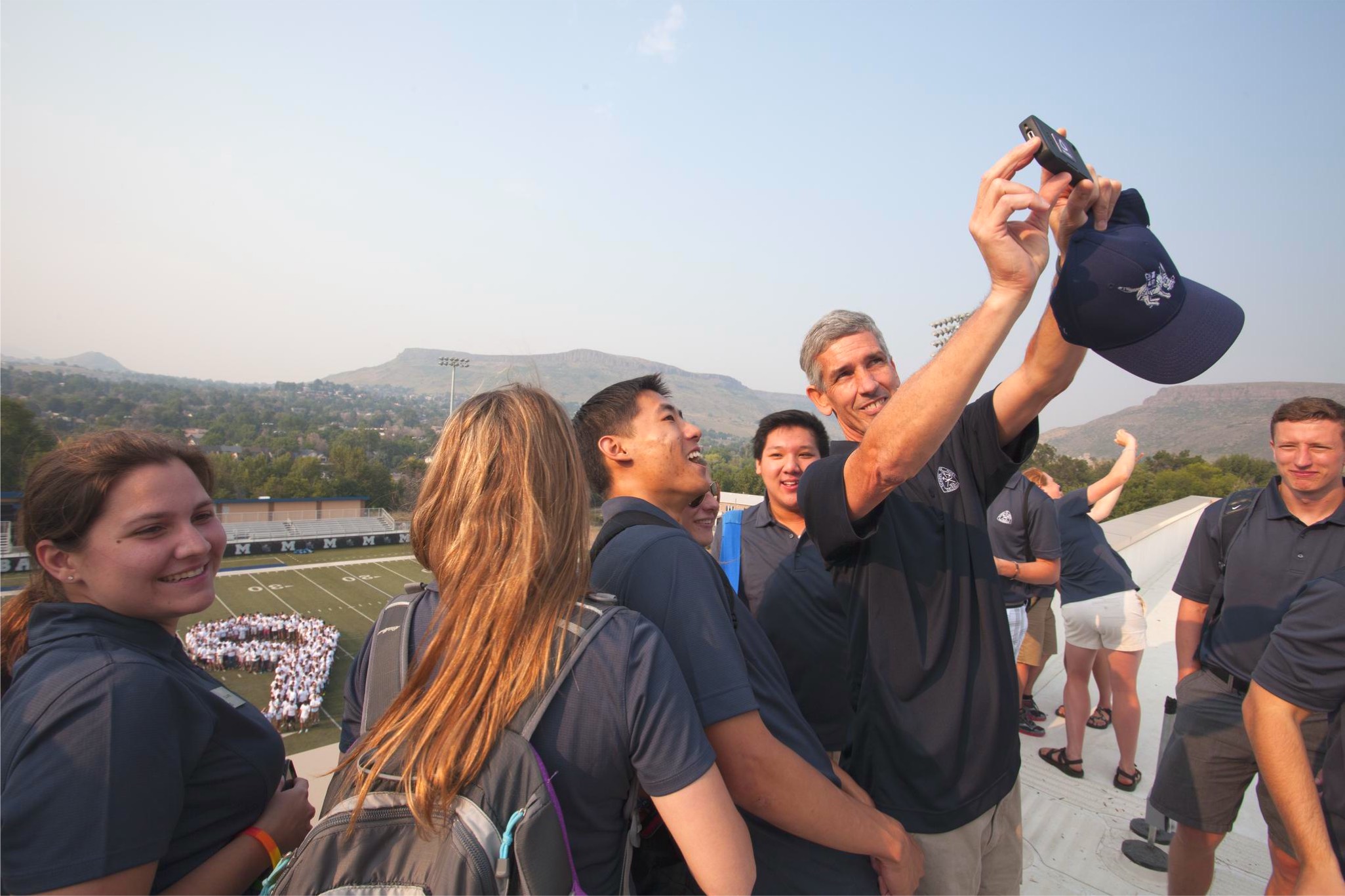 President Paul C. Johnson taking a group selfie with students